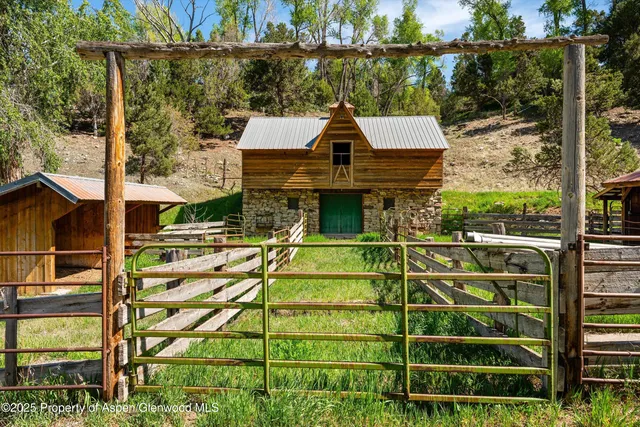 a view of a balcony with yard