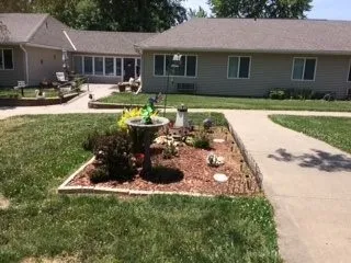 a view of a house with swimming pool and sitting area