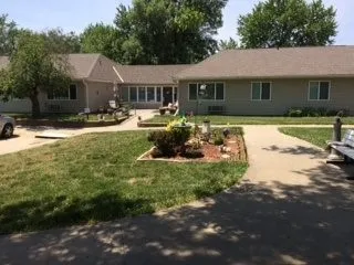 a house with swimming pool in front of it