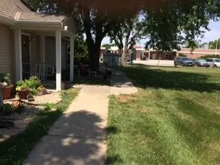 a view of a house with a yard