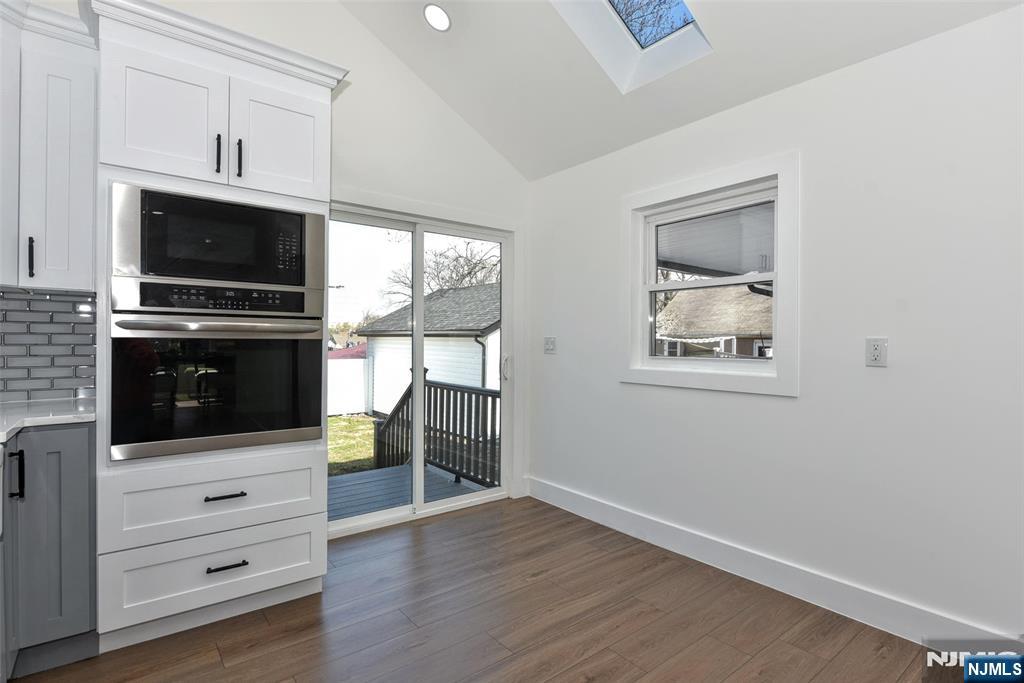 100 Chestnut Street Rochelle Park, NJ 07662 - Photo 13 of 42 a kitchen with a microwave and a stove top oven