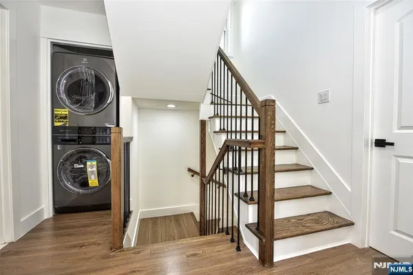 a view of a hallway with washer and dryer