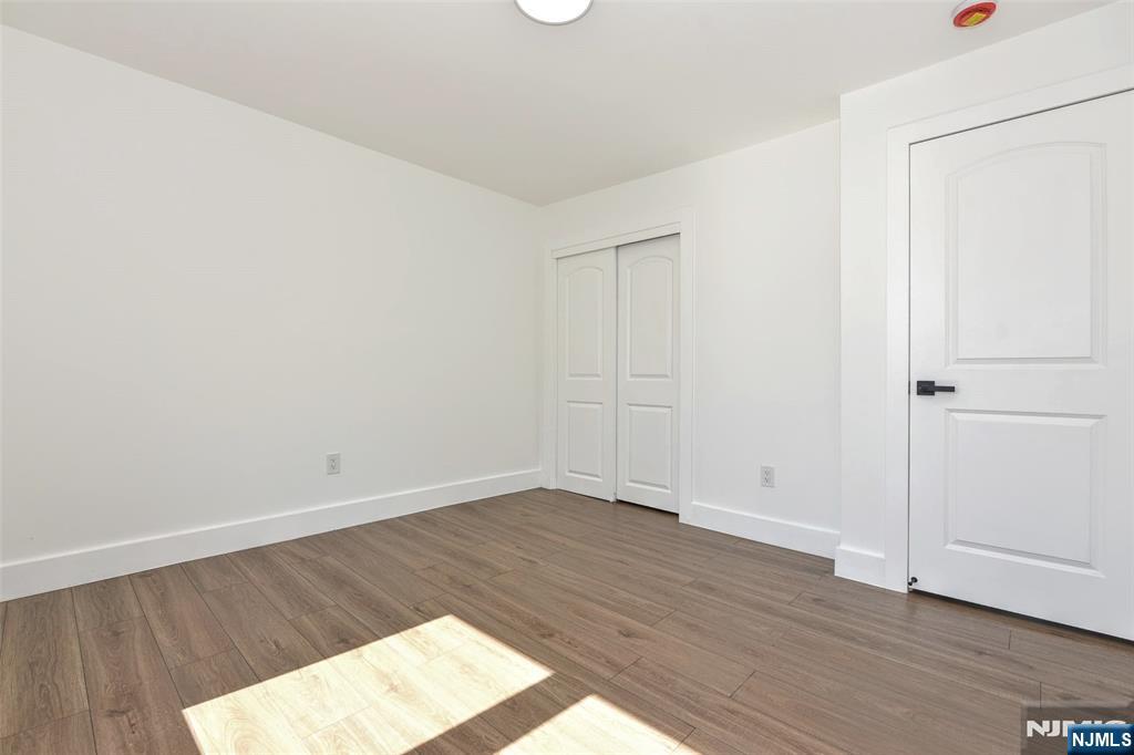 100 Chestnut Street Rochelle Park, NJ 07662 - Photo 20 of 42 an empty room with wooden floor