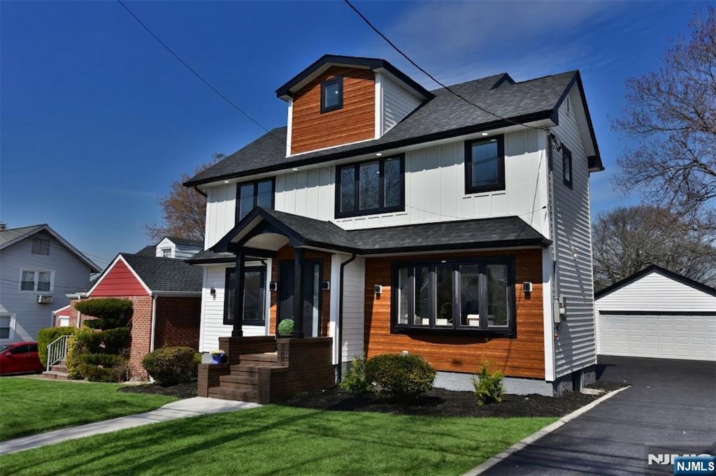 100 Chestnut Street Rochelle Park, NJ 07662 - Photo 2 of 42 a front view of a house with garden