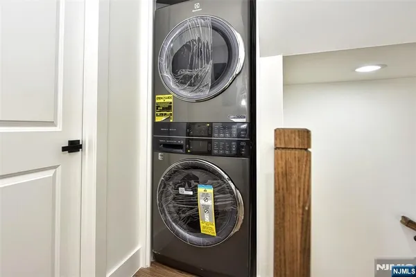 a close view of a utility room with dryer and washer