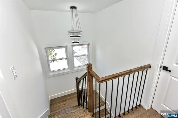 a view of a hallway with windows