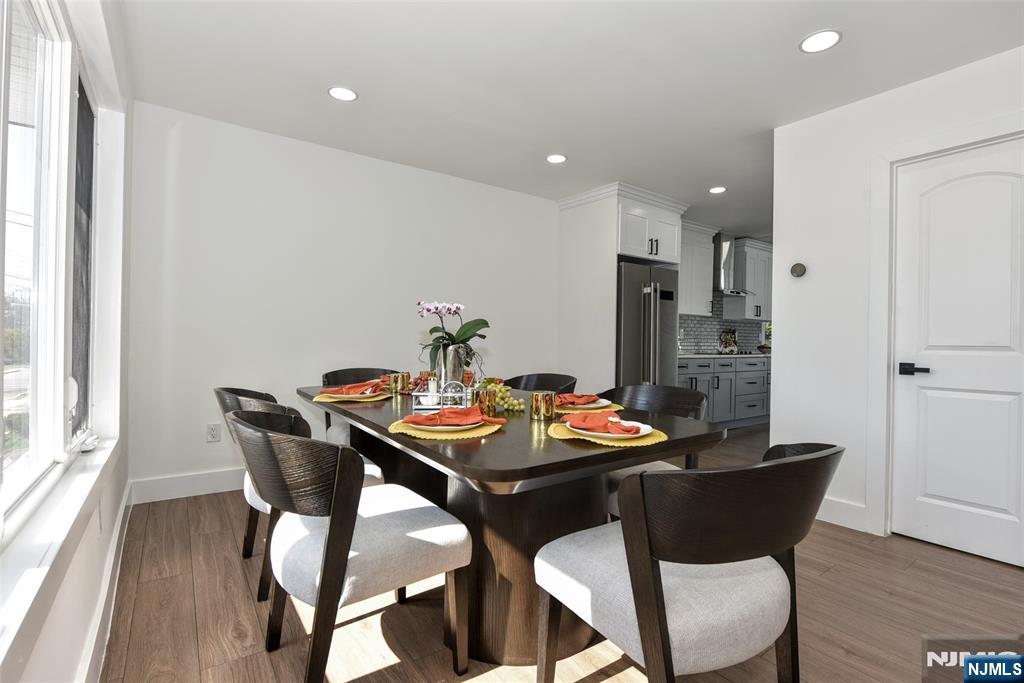 100 Chestnut Street Rochelle Park, NJ 07662 - Photo 8 of 42 a view of a dining room with furniture and wooden floor