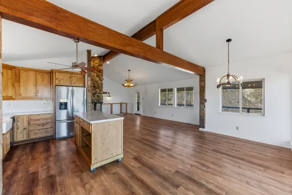 a kitchen with stainless steel appliances granite countertop a sink stove and oven