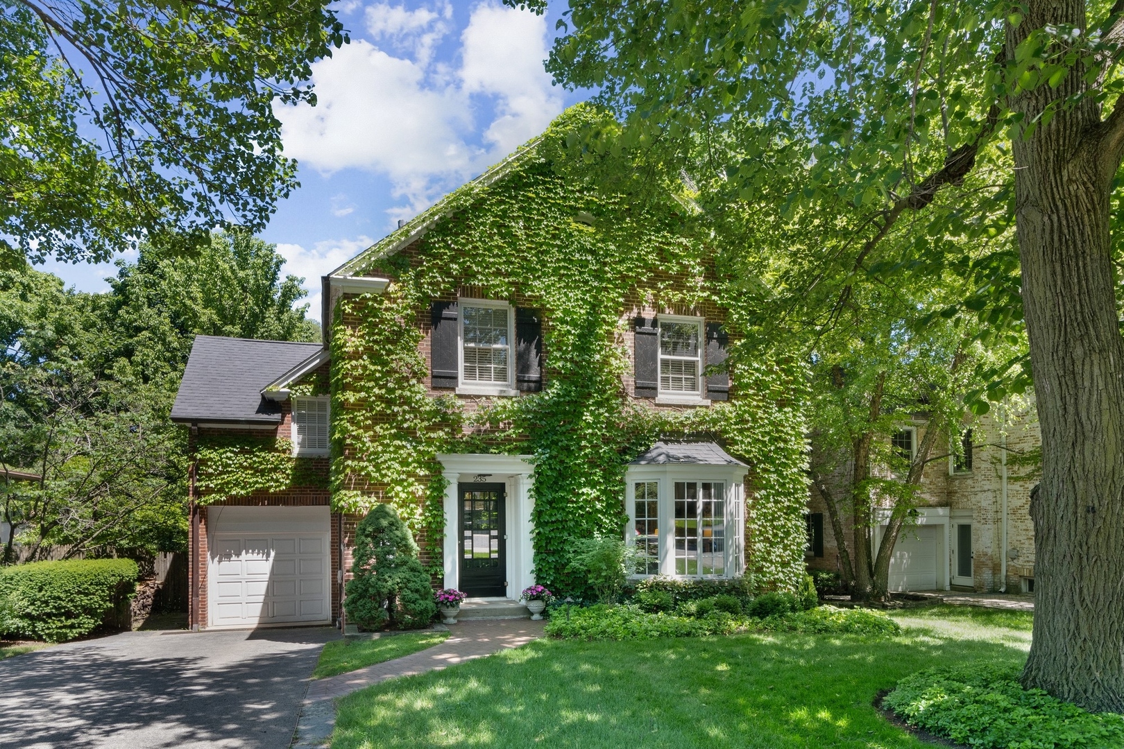 235 Church Road Winnetka, IL 60093 - Photo 1 of 27 front view of a house with a yard