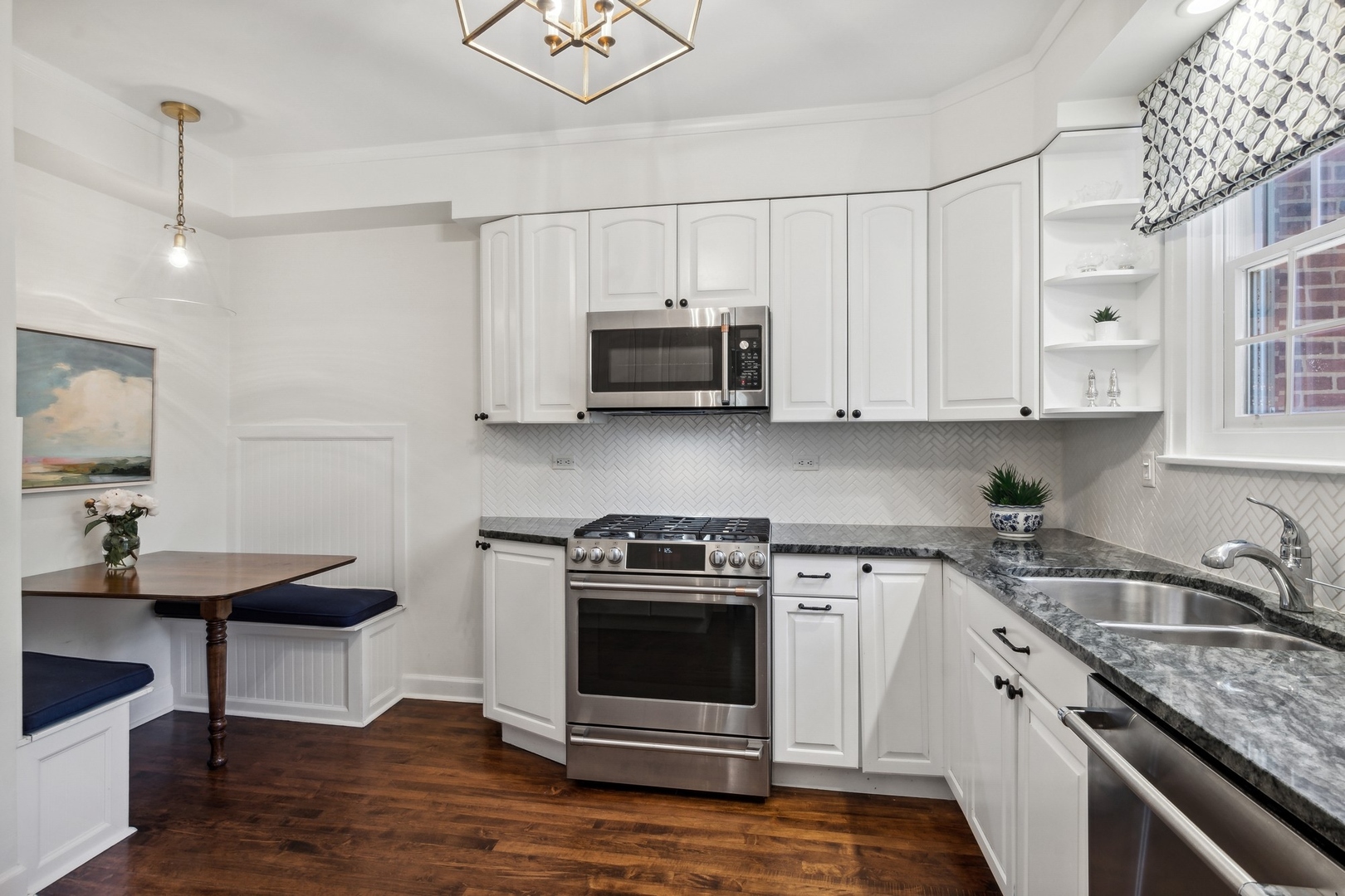 235 Church Road Winnetka, IL 60093 - Photo 13 of 27 a kitchen with stainless steel appliances granite countertop a sink stove and cabinets