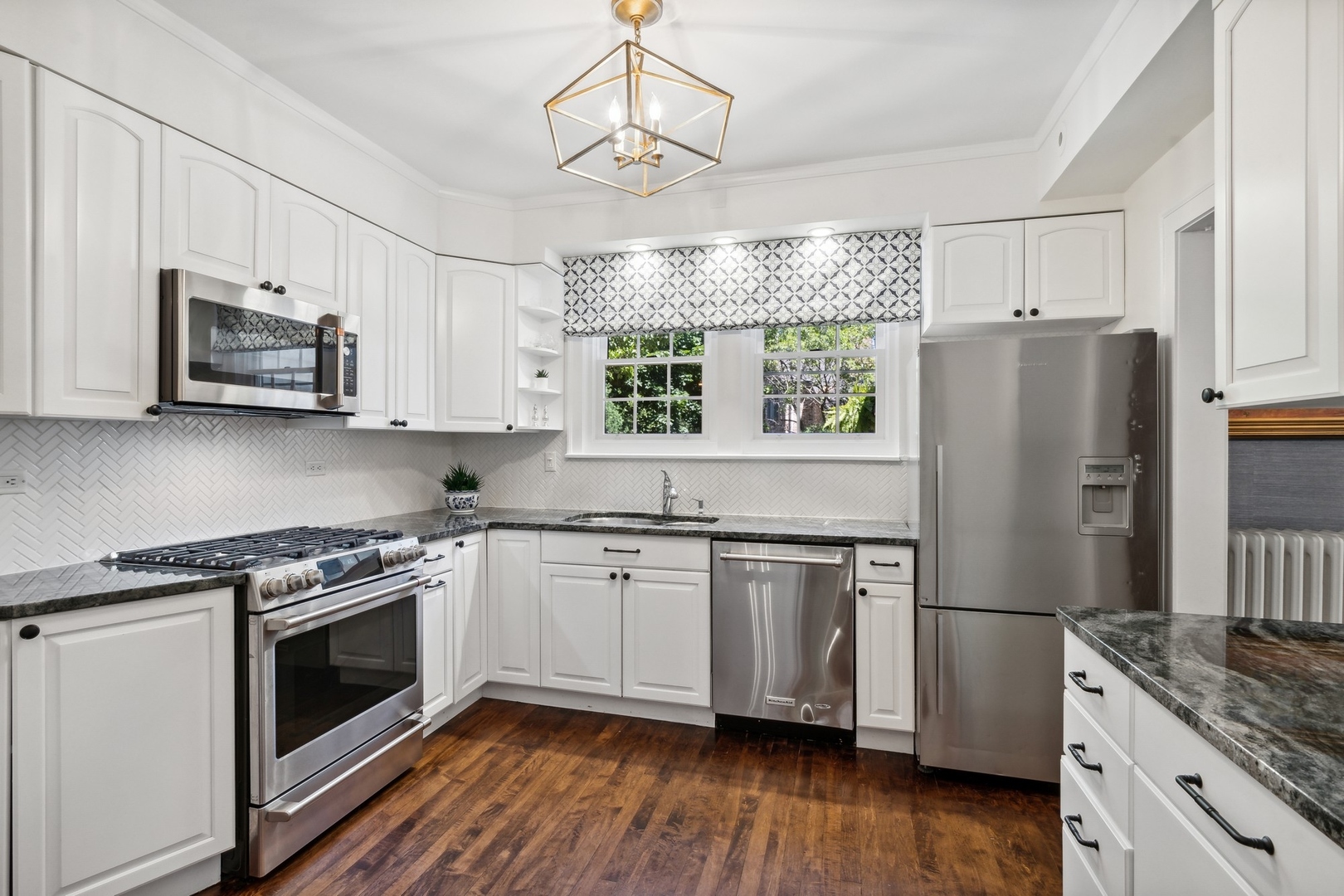 235 Church Road Winnetka, IL 60093 - Photo 14 of 27 a kitchen with stainless steel appliances a stove a sink and a refrigerator