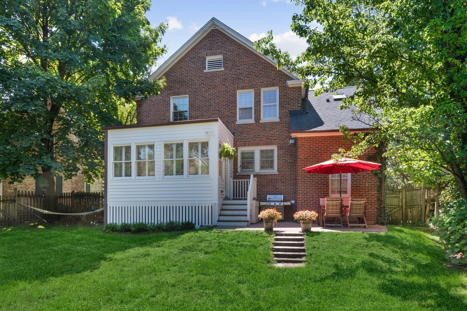 235 Church Road Winnetka, IL 60093 - Photo 26 of 27 a front view of a house with a garden