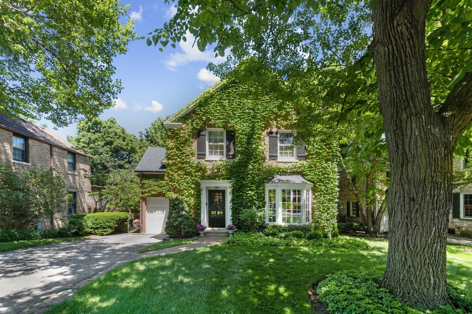 235 Church Road Winnetka, IL 60093 - Photo 27 of 27 a front view of a house with a garden