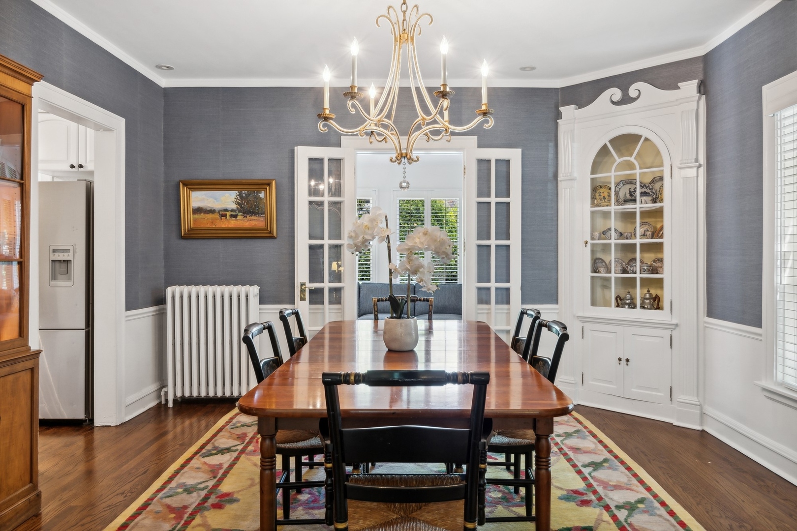 235 Church Road Winnetka, IL 60093 - Photo 8 of 27 a view of a dining room with furniture wooden floor and chandelier