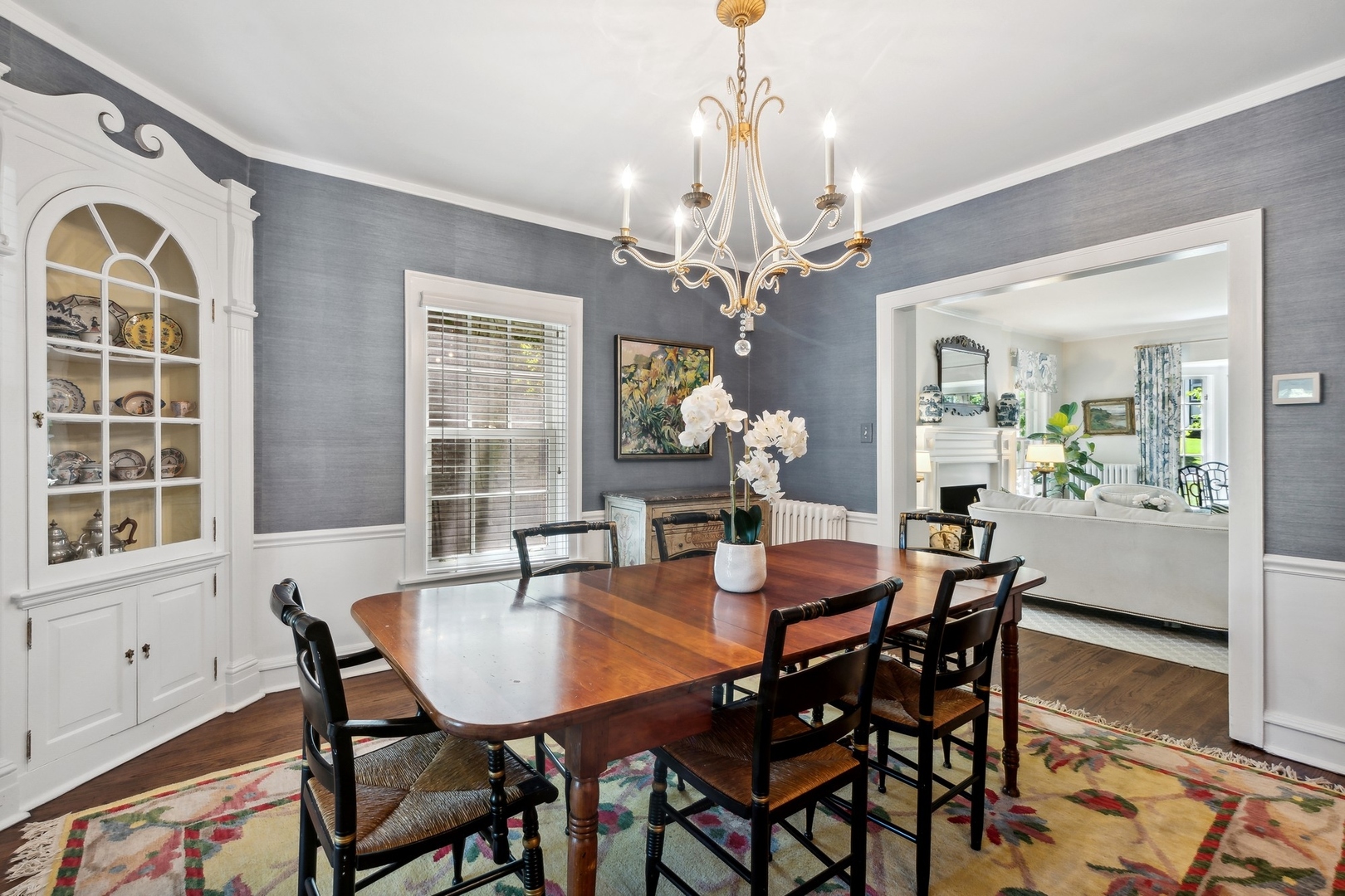 235 Church Road Winnetka, IL 60093 - Photo 9 of 27 a dining room with furniture a chandelier and a rug