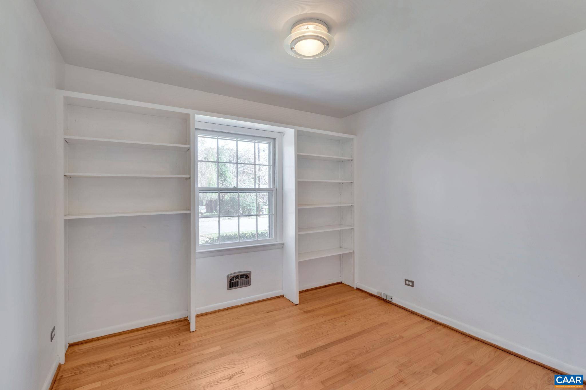 1406 Holly Road Charlottesville, VA 22901 - Photo 31 of 62 a view of an empty room with a window