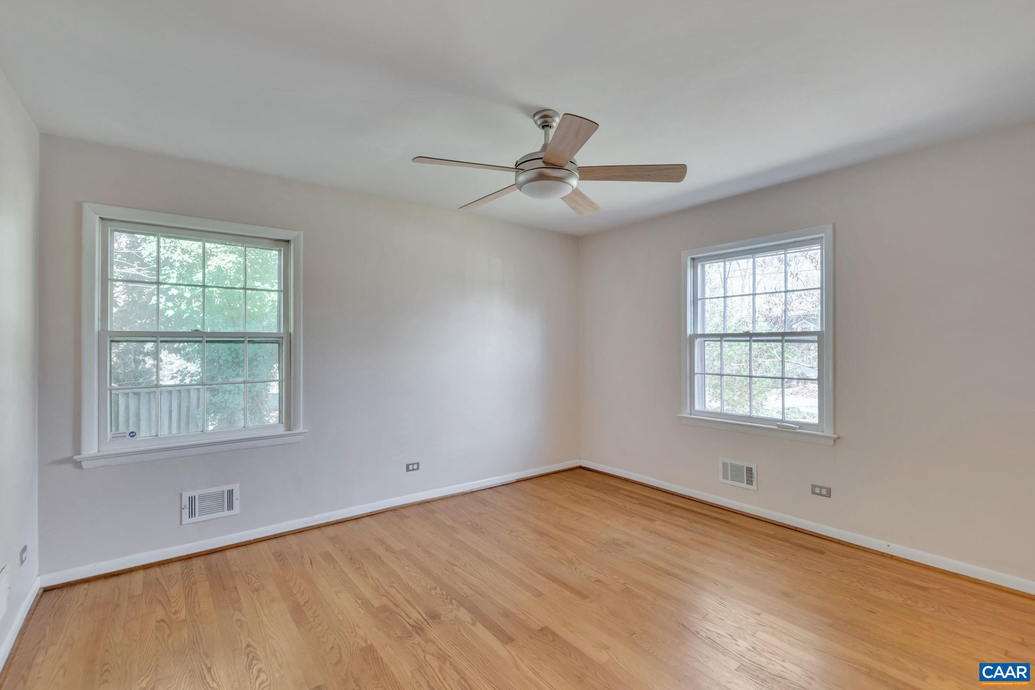 1406 Holly Road Charlottesville, VA 22901 - Photo 33 of 62 wooden floor in an empty room with a window