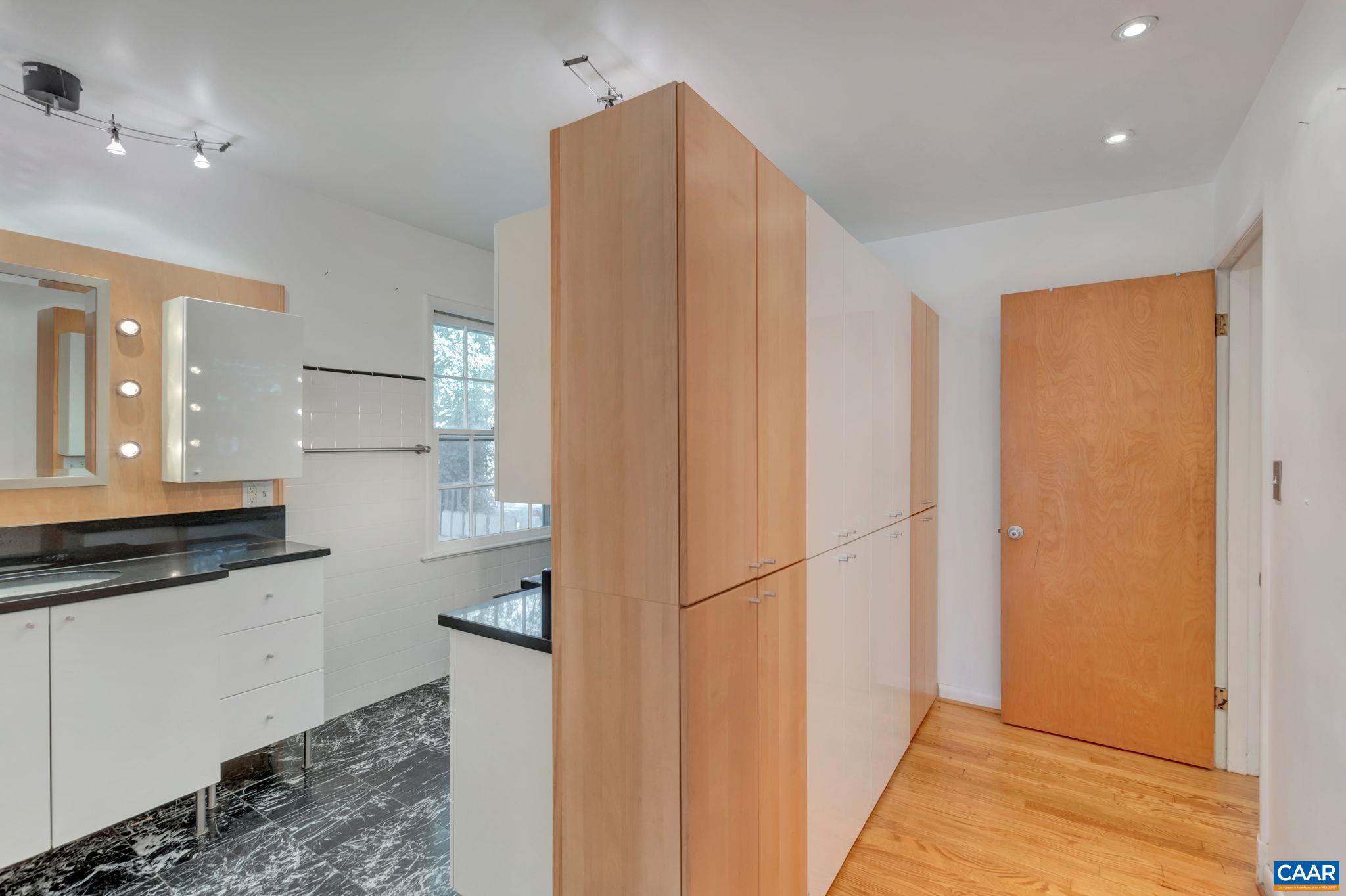 1406 Holly Road Charlottesville, VA 22901 - Photo 38 of 62 a kitchen with stainless steel appliances a refrigerator and a sink