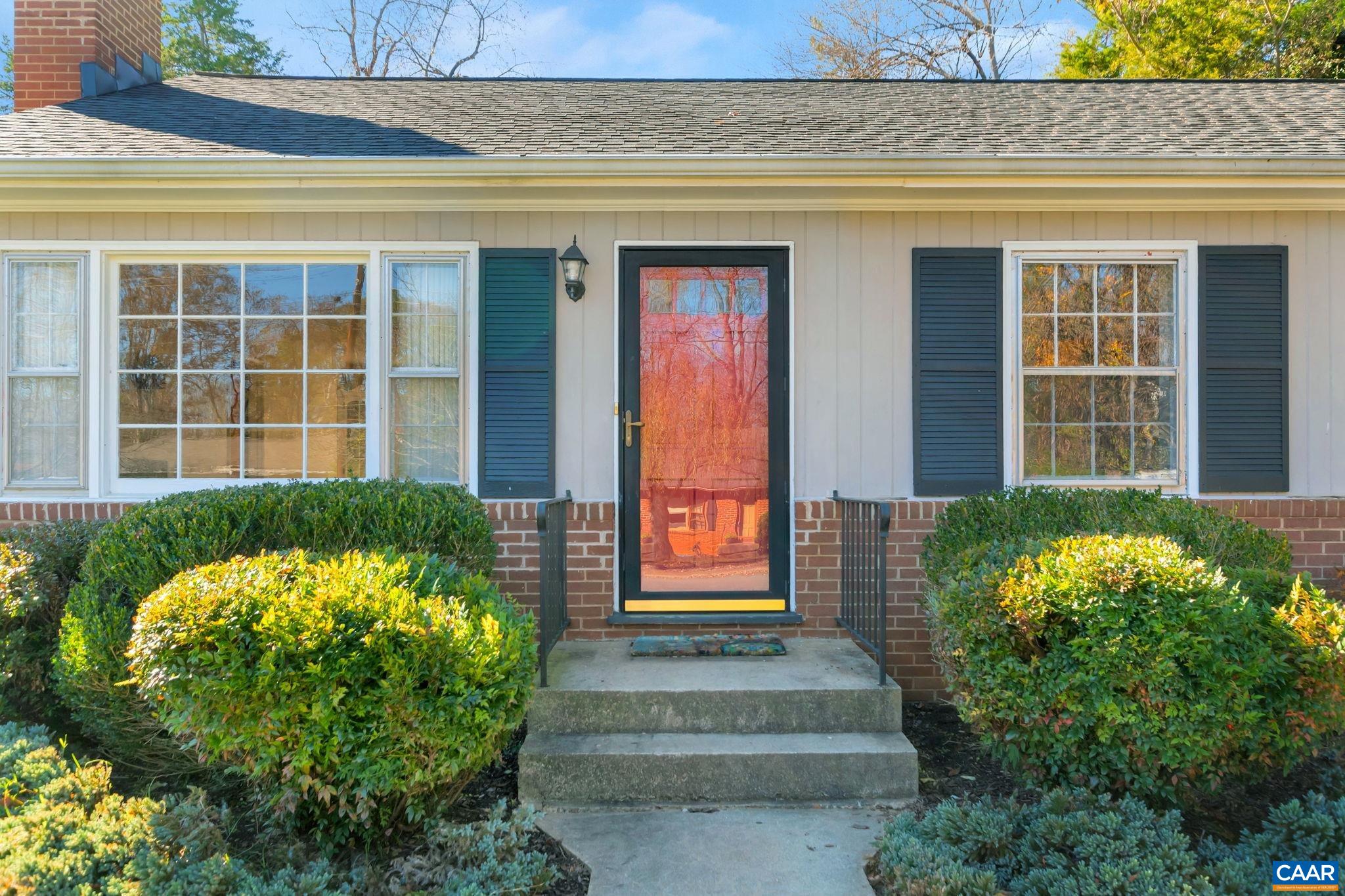 1406 Holly Road Charlottesville, VA 22901 - Photo 4 of 62 a front view of a house with a yard