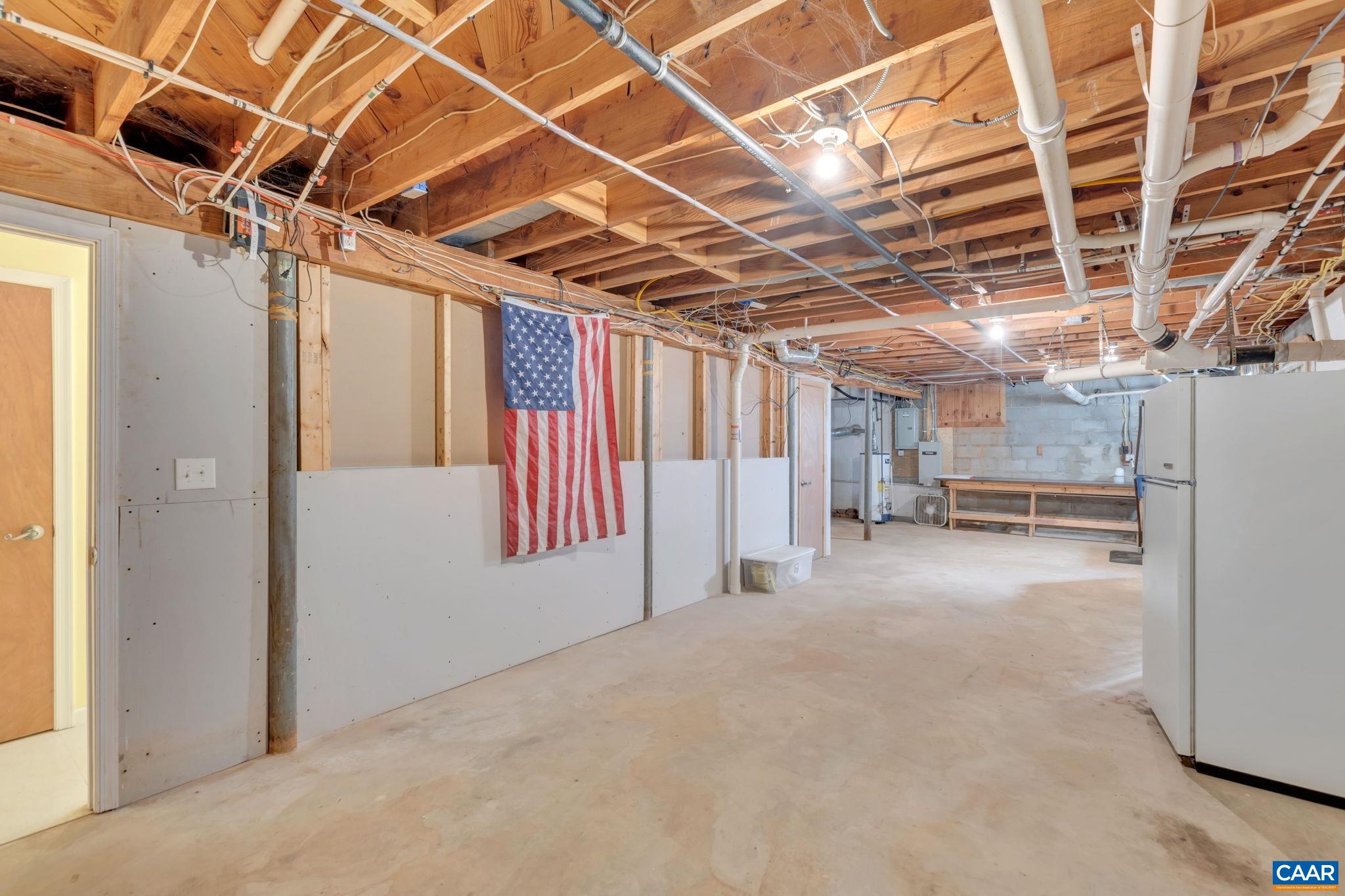 1406 Holly Road Charlottesville, VA 22901 - Photo 48 of 62 a view of empty room with wooden ceiling