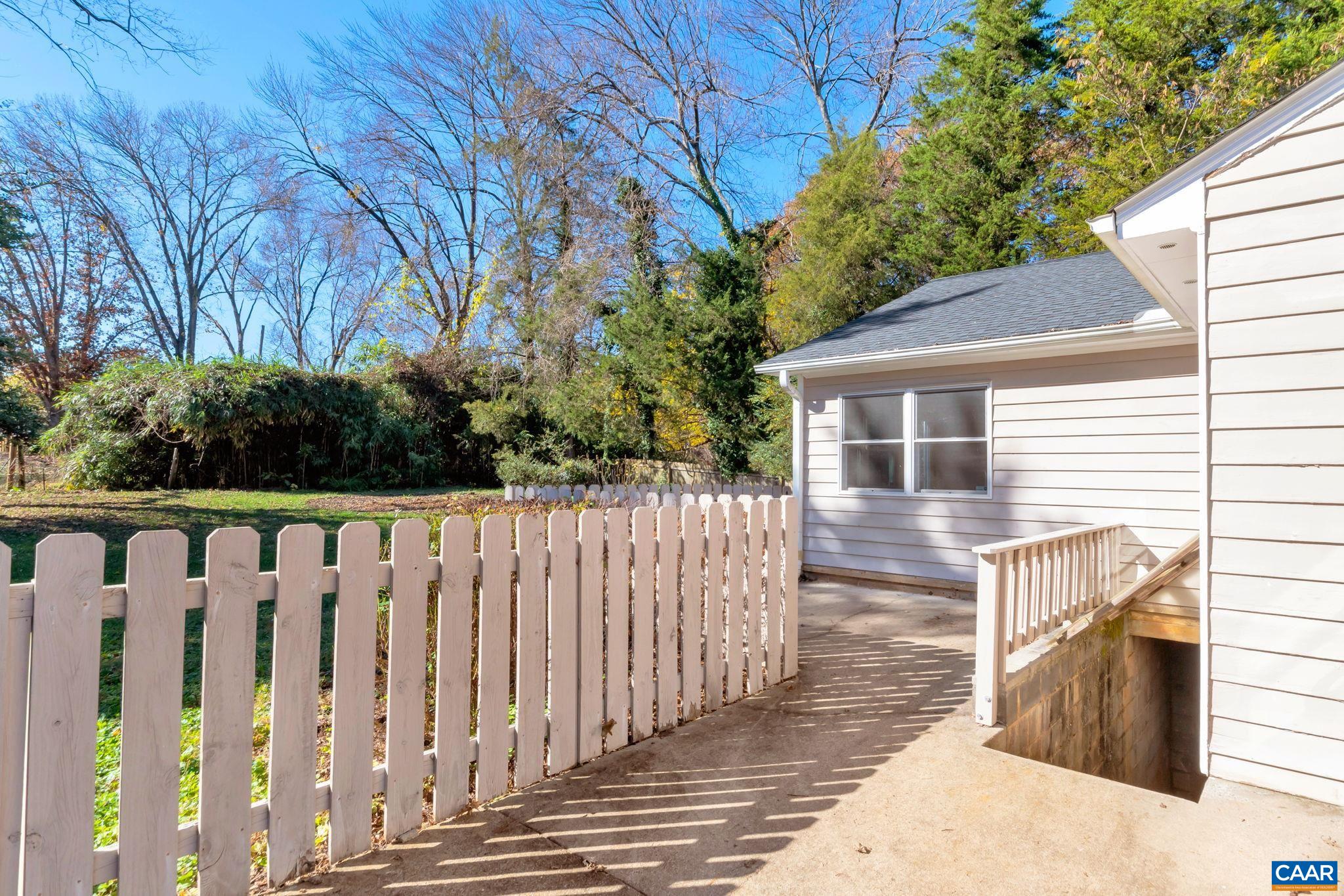 1406 Holly Road Charlottesville, VA 22901 - Photo 51 of 62 a view of a house with backyard and deck