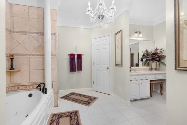 a bathroom with a sink vanity and a mirror