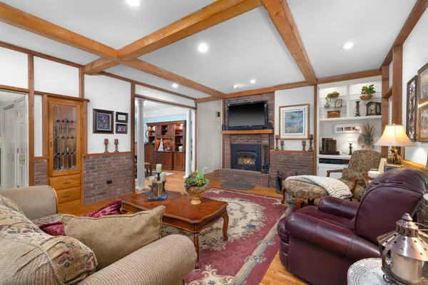 a living room with furniture and a rug