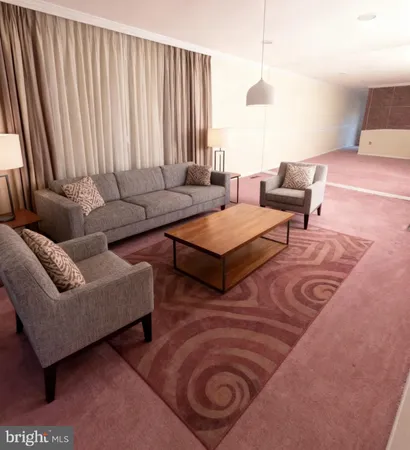 a white toilet sitting next to a bath tub