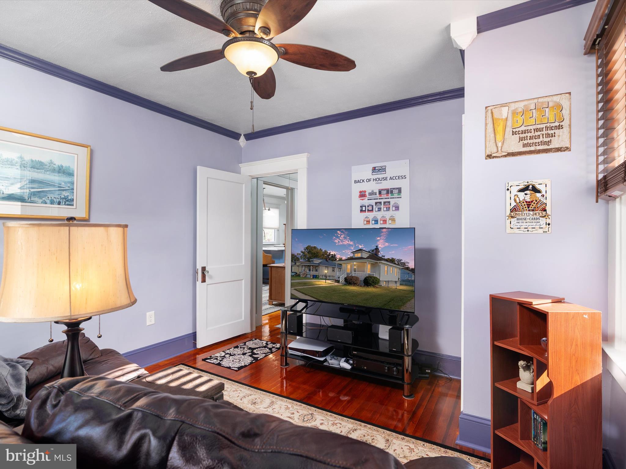 3669 Hineline Road Baltimore, MD 21229 - Photo 17 of 33 a bedroom with a bed and a chandelier