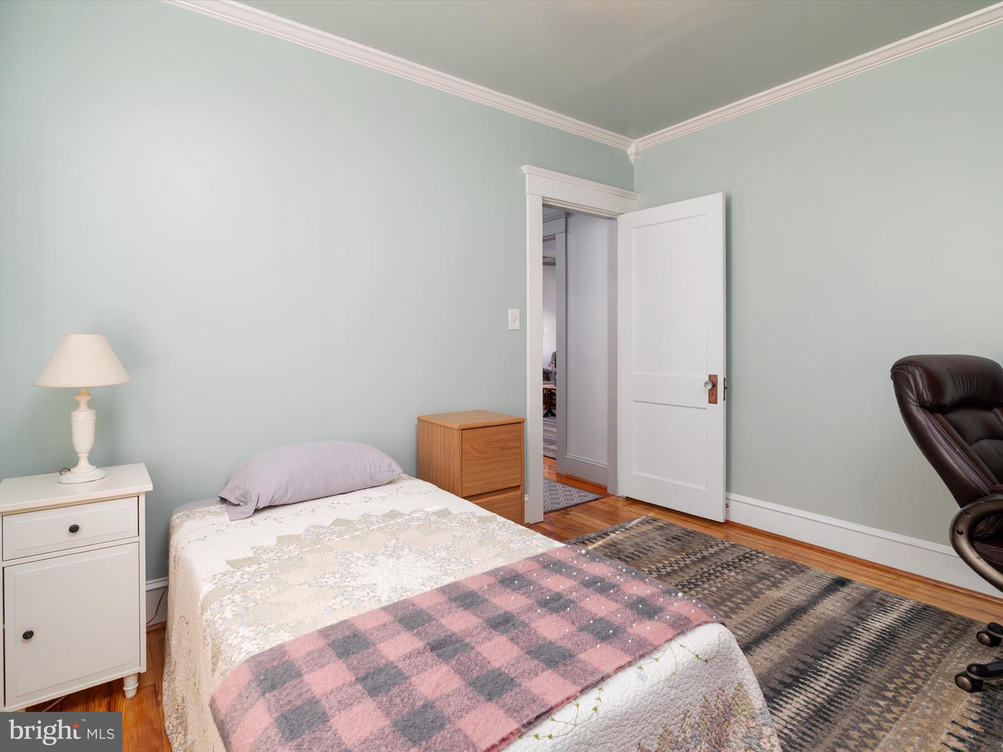 3669 Hineline Road Baltimore, MD 21229 - Photo 19 of 33 a bedroom with a bed and a lamp on dresser