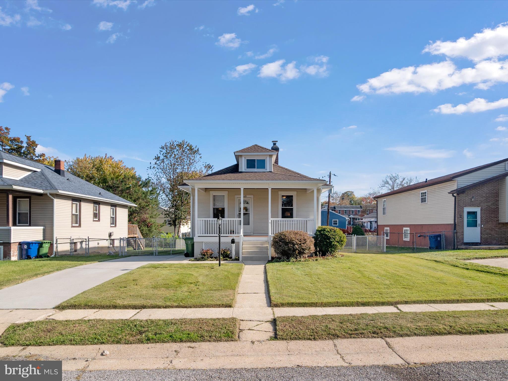 3669 Hineline Road Baltimore, MD 21229 - Photo 2 of 33 a front view of a house with a yard