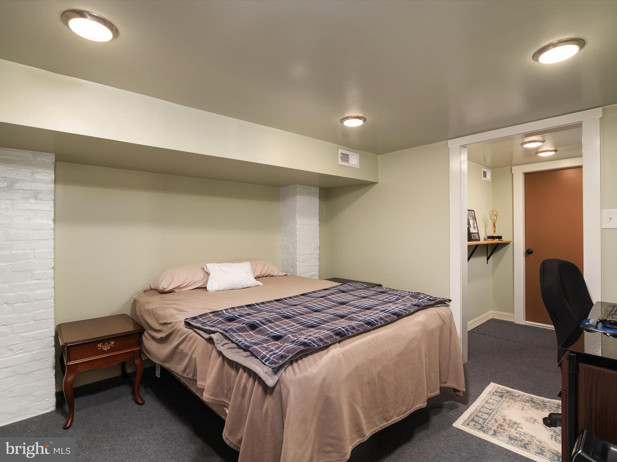 3669 Hineline Road Baltimore, MD 21229 - Photo 25 of 33 a bedroom with a bed and a chair in it