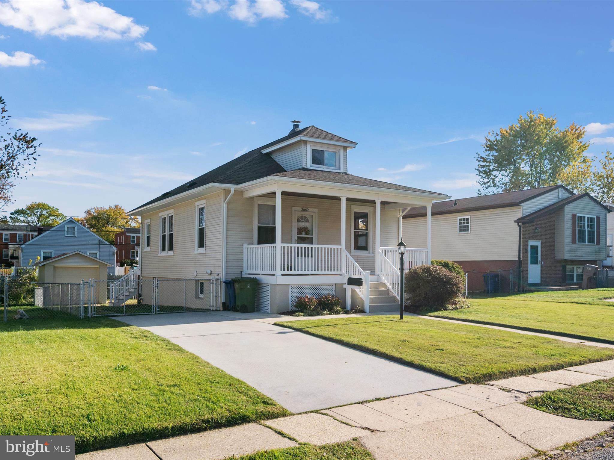 3669 Hineline Road Baltimore, MD 21229 - Photo 3 of 33 a front view of a house with a yard and garage