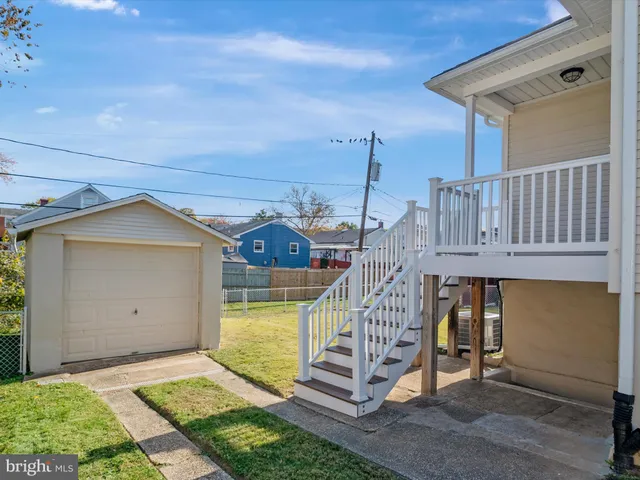 a front view of a house with wooden fence
