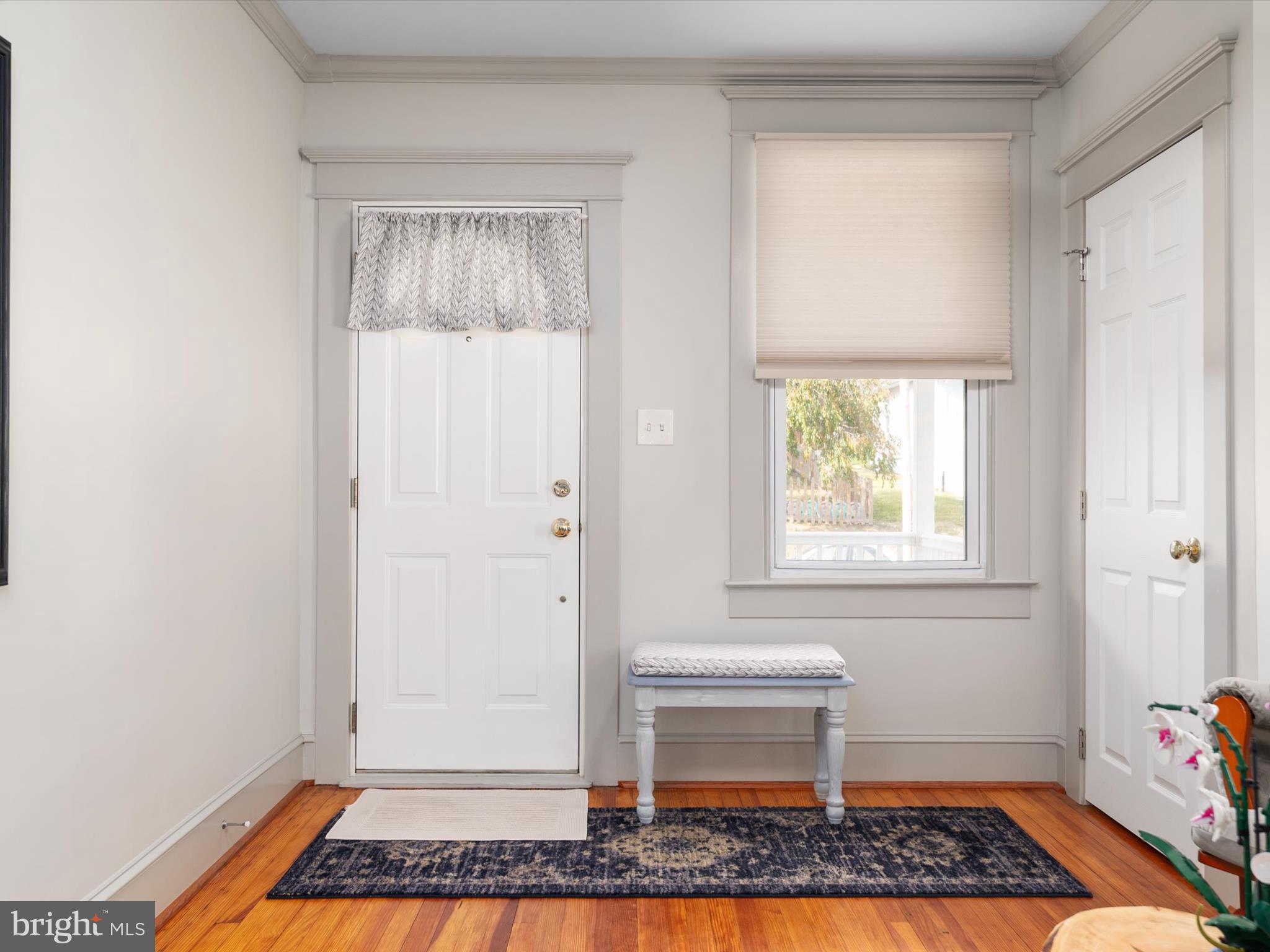 3669 Hineline Road Baltimore, MD 21229 - Photo 5 of 33 a view of an entryway with wooden floor and a rug