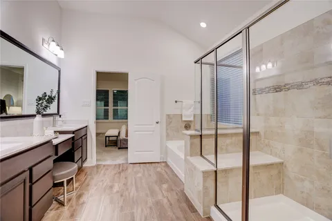 a bathroom with a tub and shower