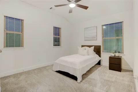 a bedroom with a bed and window