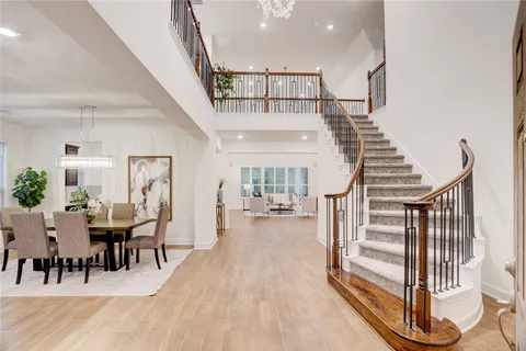 a view of a hallway with furniture and entryway
