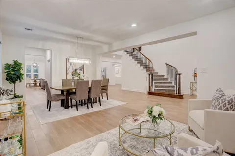 a living room with furniture potted plant and a window