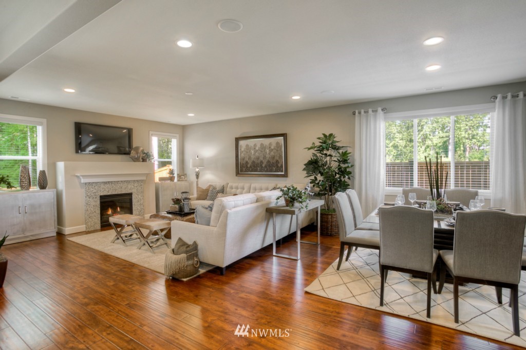 3304 170th Place Southeast, Unit 26 Bothell, WA 98012 - Photo 11 of 20 a living room with fireplace furniture and a wooden floor