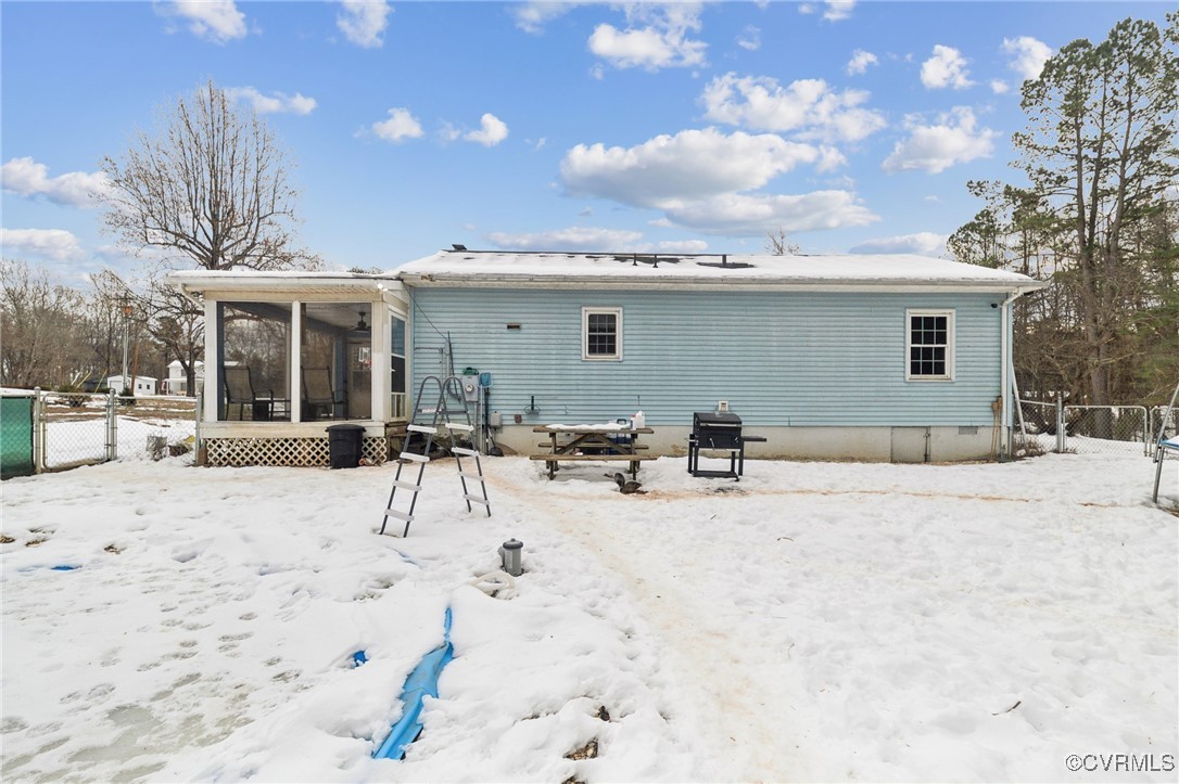 1235 Ridgeview Road Reva, VA 22735 - Photo 23 of 33 Snow covered back of property with a sunroom
