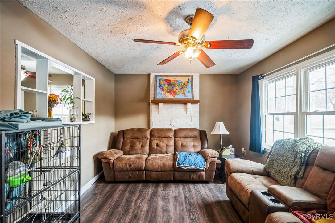 1235 Ridgeview Road Reva, VA 22735 - Photo 7 of 33 Living room with a textured ceiling, dark vinyl fl