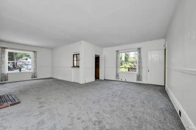 an empty room with windows