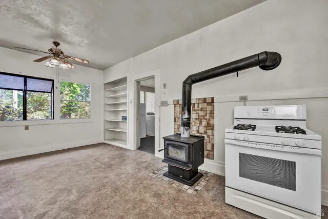 a bathroom with a toilet a sink and a window