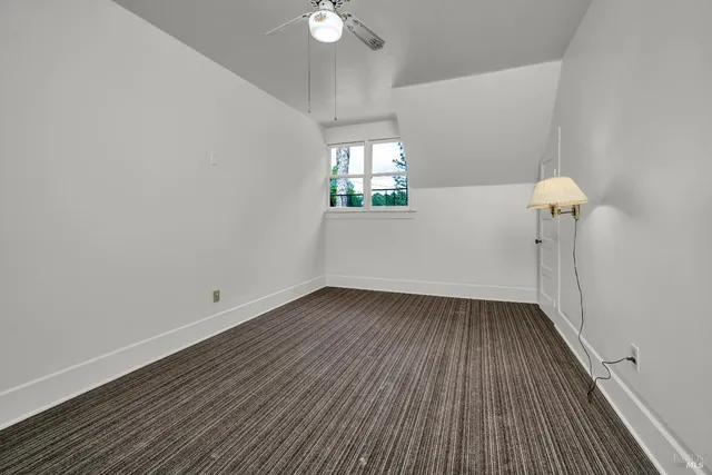 a view of a balcony with wooden floor
