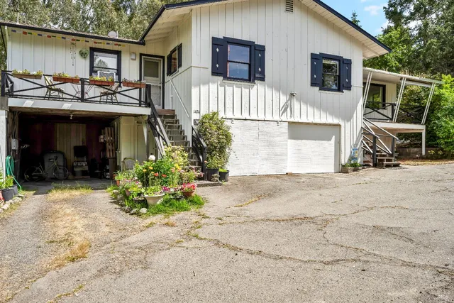 a bedroom with a bed and a table in it
