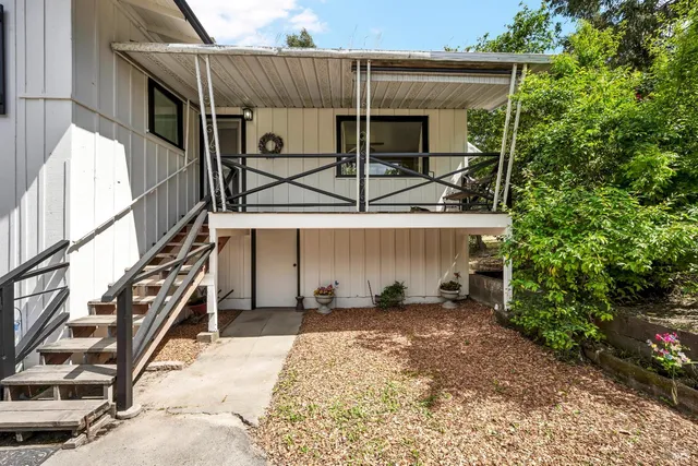 a kitchen with stainless steel appliances a sink a stove and a window