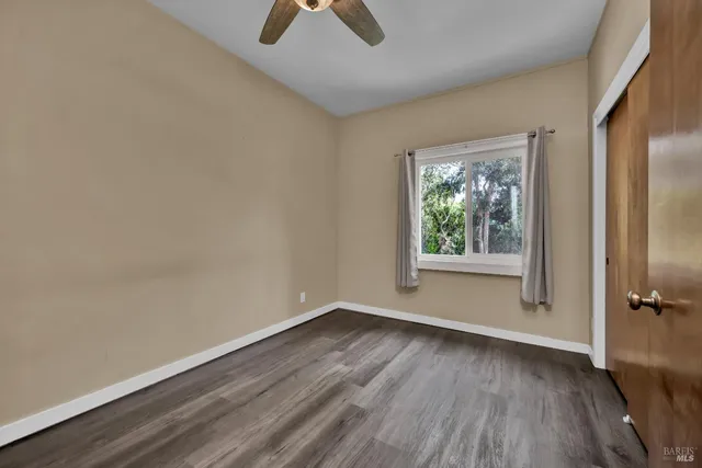 a view of a green field with lots of bushes