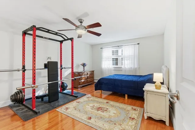 a bedroom with furniture and a window