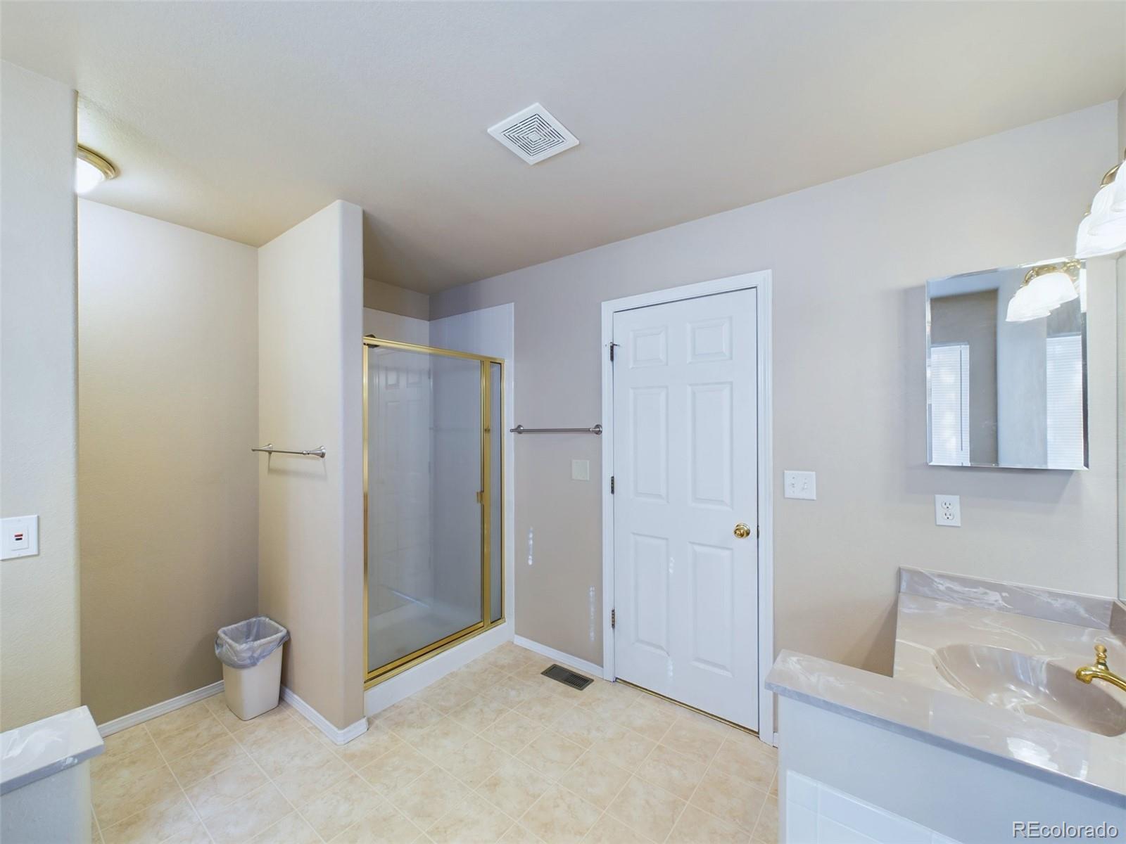 5140 Shoup Road Colorado Springs, CO 80908 - Photo 13 of 42 a bathroom with a sink and a shower